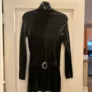 Black fitted sweater.  Belt attached.  Turtle neck style.  So cute on.